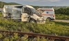 Accident petrecut la o trecere la nivel cu calea ferată! O autoutilitară condusă de un ieșean a fost lovită de un tren