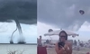 Momentul în care o plajă plină de turiști este lovită de o tornadă. Rafalele de vânt au făcut prăpăd