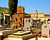 Hoție în miez de noapte într-un cimitir din Italia. Doi români prinși în flagrant în timp ce furau jgheaburi