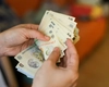 Salariile românilor ar putea scădea de la 1 iulie! Milioane de cetățeni afectați de decizia Guvernului