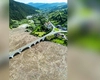 Dezastru ecologic pe lacul Izvorul Muntelui în urma inundaţiilor! Viaductul de la Poiana Largului, blocat de o mare de lemne și resturi