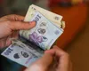 Salariul mediu net a scăzut! Cu câți bani rămân românii