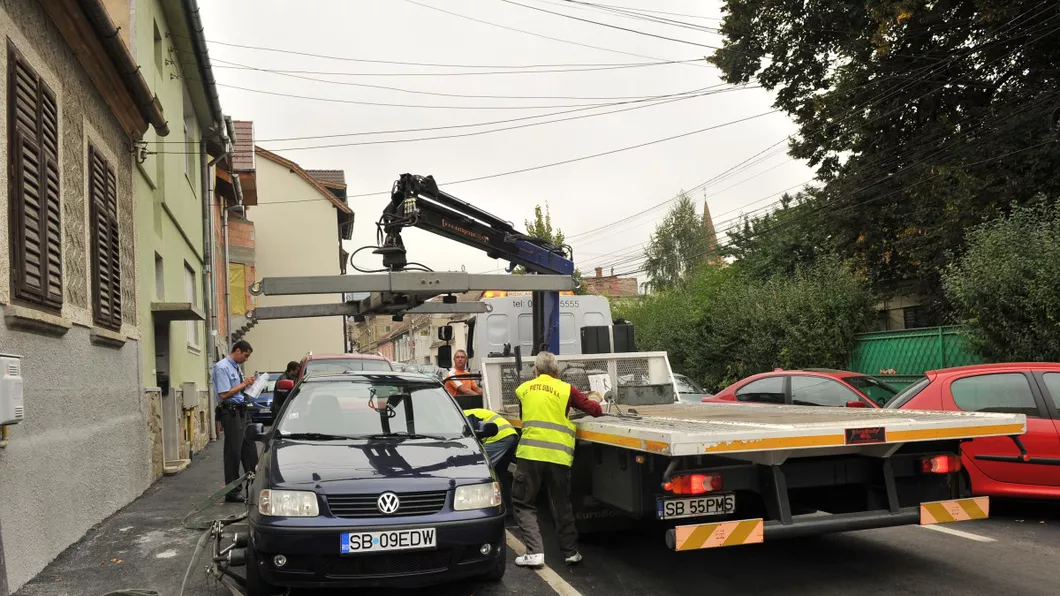 Oficial Poliția Rutieră poate ridica mașinile staționate neregulamentar. Președintele Klaus Iohannis a promulgat legea