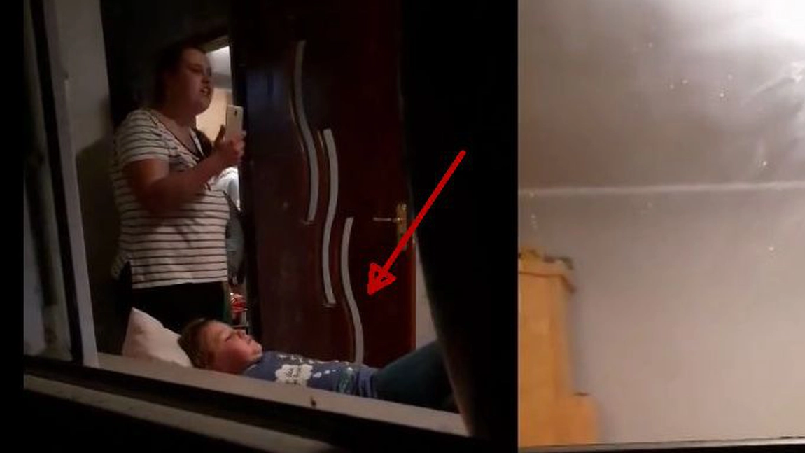 Exclusiv! Momente cumplite pentru acesti copilasi! In timp ce mama lor este plecata in strainate, ei sunt batuti de un individ beat! Filmarea este facuta chiar de unul dintre copii - VIDEO
