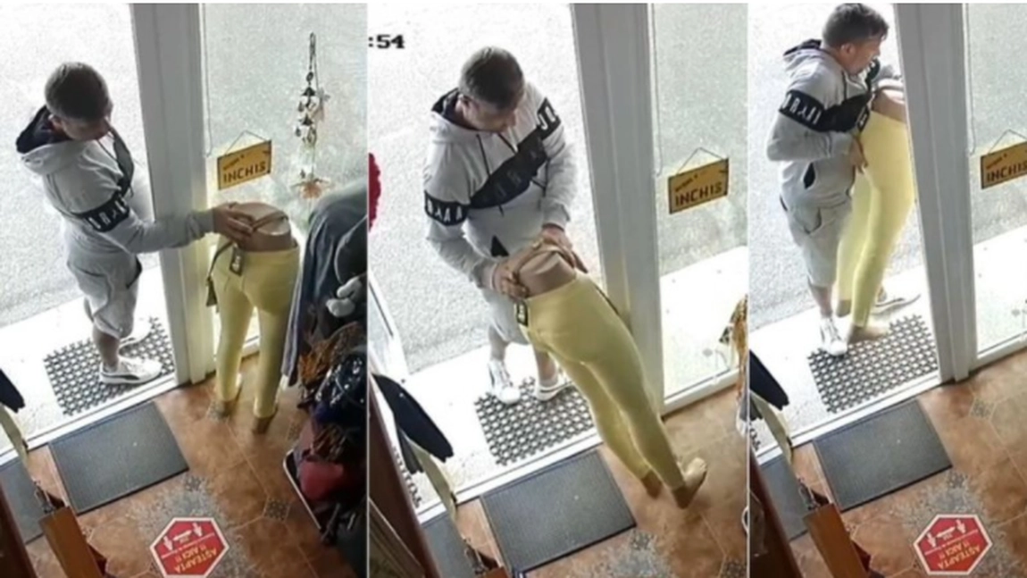 Un bărbat, surprins în timp ce fură haine dintr-un magazin din Bârlad, cu tot cu manechin, în plină zi