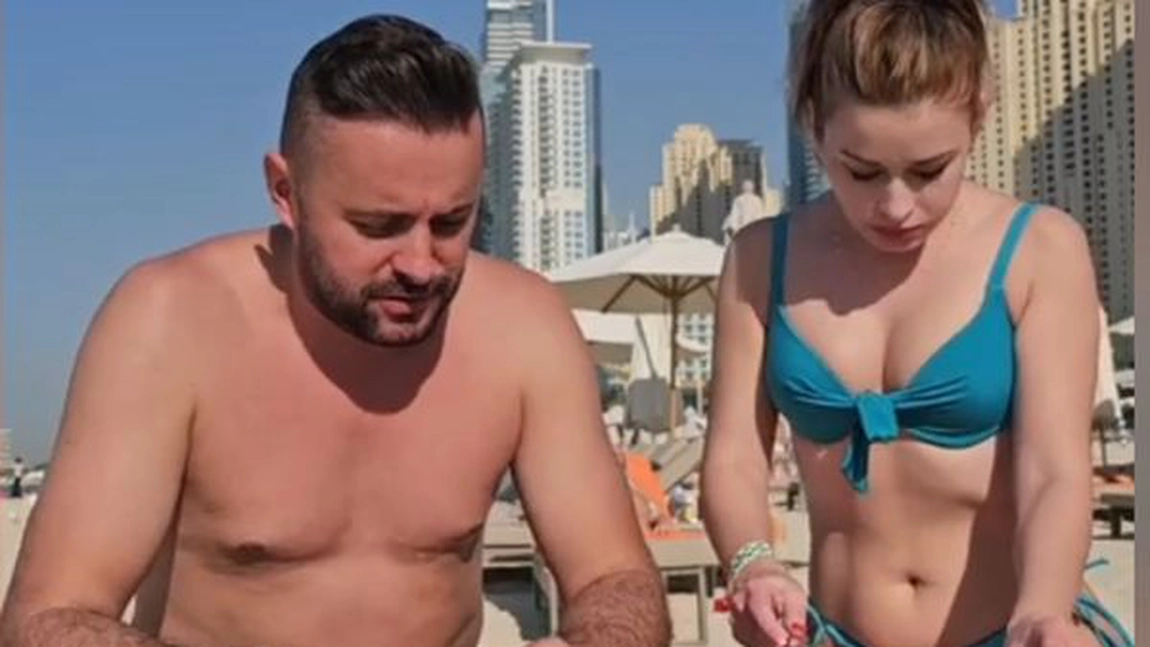 Aroganță pe o plajă în Dubai! Doi români au mâncat slănină cu ceapă lângă Burj Al-Arab! - VIDEO