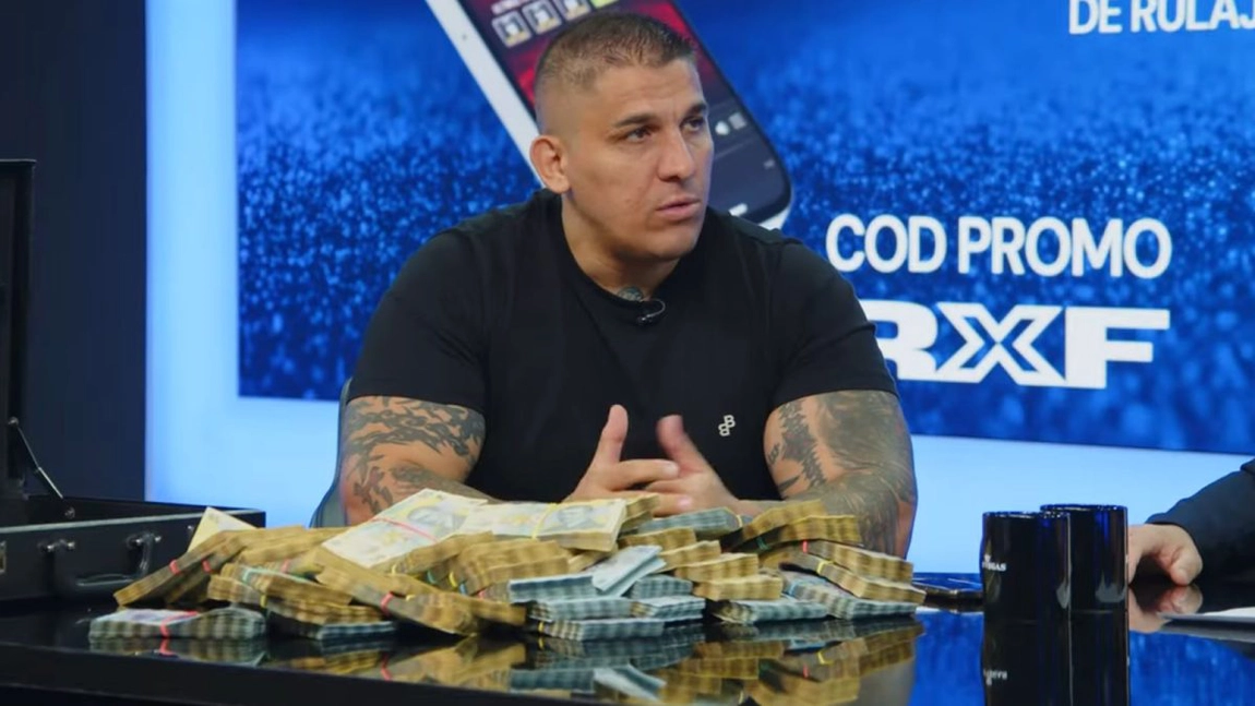 Adrian Corduneanu a semnat contractul pentru lupta cu Băcăoanu. A pus un diplomat cu 500.000 de lei pe masă: „Donez banii la case de copii”