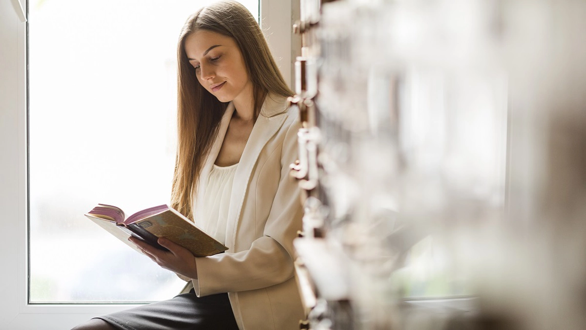 back-school-concept-with-woman-studying-library