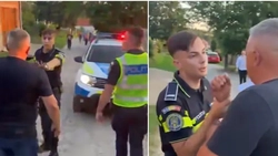 Polițist atacat de săteni furioși după ce a oprit un tânăr beat pe ATV! A fost nevoie să-și scoată pistolul