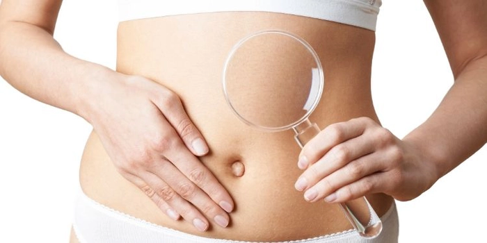 grafica lupa in dreptul stomacului unei persoane care sufera de colon iritabil