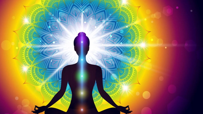 grafica persoana care face yoga sunt evidentiate de culorile chakrelor