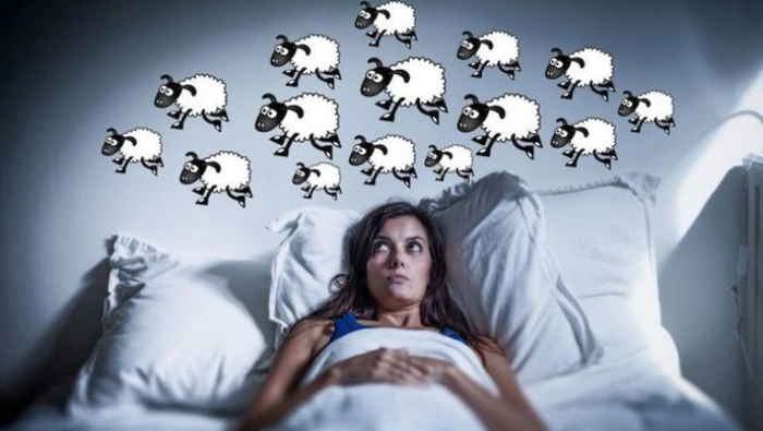 grafica persoana care sufera de insomnie si numara oi