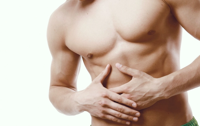 barbat care se tine de abdomen din cauza nevralgiei
