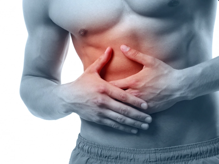 grafica barbat care se tine de partea dreapta a abdomenului din cauza unei crize de fiere