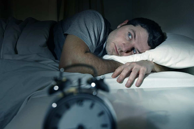 persoană care suferă de insomnie